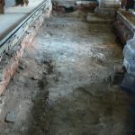 Removal of rotten timbers to Nave floor looking East